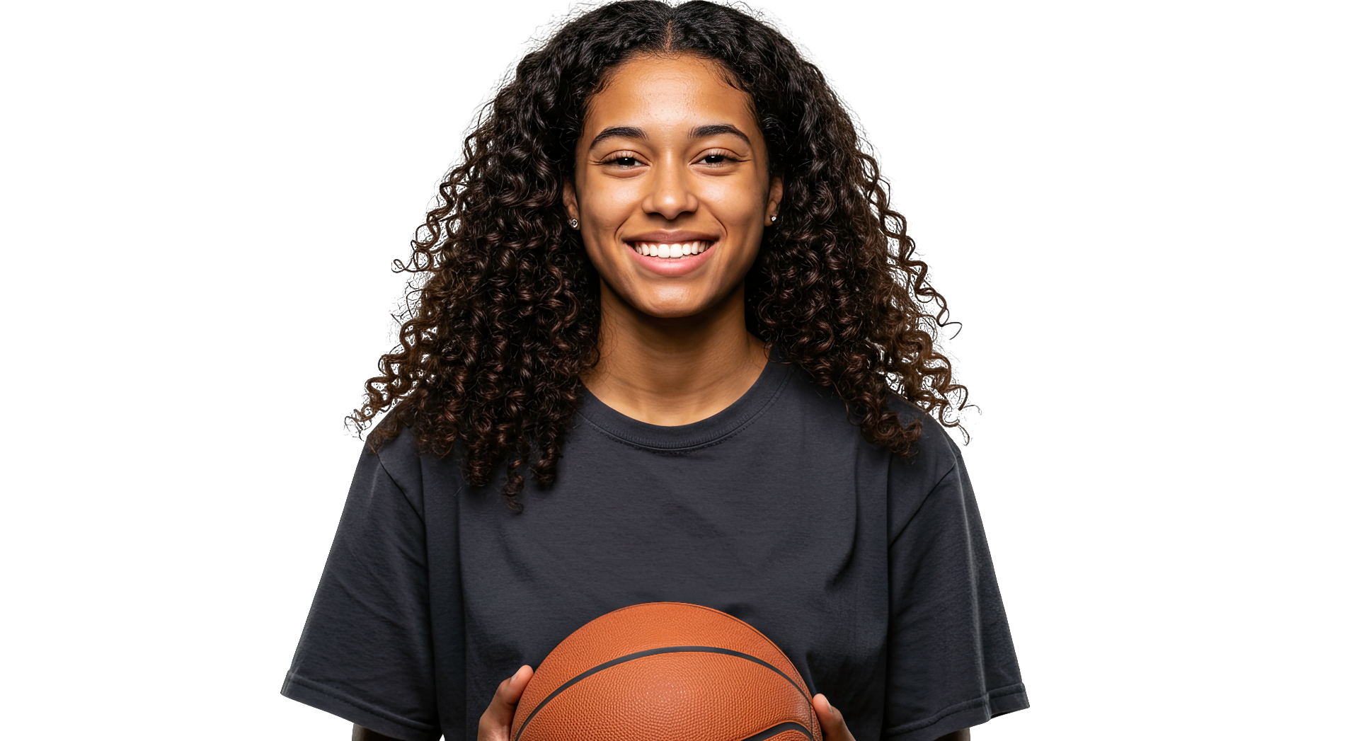 Young woman basketball player smiling, holding a basketball